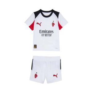 Kids football kit with AC Milan logo, Puma branding, and sponsor logo.