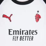 Puma and Ajax logos on white football jersey with Emirates sponsor.
