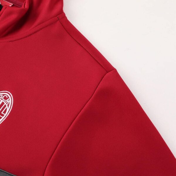 AC Milan pre-match jacket in red, featuring team logo and modern design.