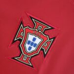 Portugal national football team emblem on 2022 home jersey.
