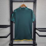 Portland Timbers 23/24 home soccer jersey in green with yellow accents.