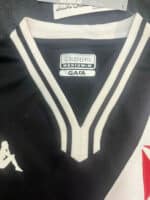 Kappa GARA black and white football jersey with V-neck design.
