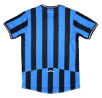 Back view of a blue and black vertically striped soccer jersey with short sleeves.
