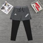 High-performance Adidas men's long shorts with attached leggings, ideal for sports and active wear.