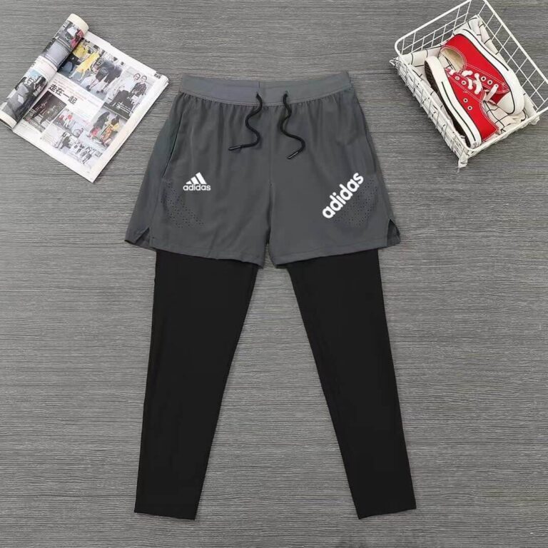 High-performance Adidas men's long shorts with attached leggings, ideal for sports and active wear.