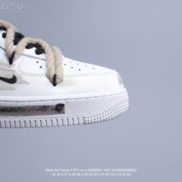 Nike Air Force Low 1 in white with light beige accents, close-up view.