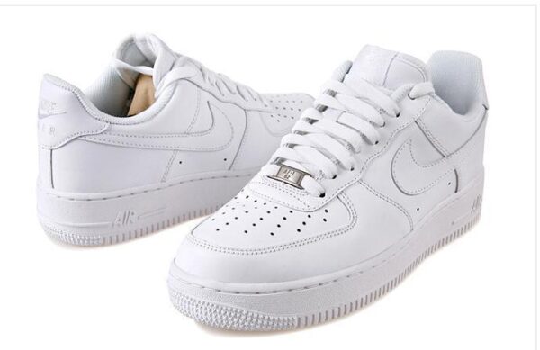White Nike Air Force 1 Low sneakers for men and women. Classic, stylish, and comfortable footwear fo.