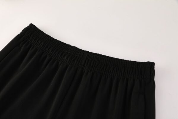 Black Nike Dri-Fit tracksuit pants for athletic performance and comfort.