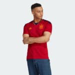 Spain 2022/23 World Cup home football jersey, authentic red kit with team crest.