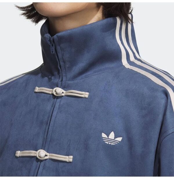Unisex dark blue adidas casual jacket with white stripes and toggle closures.