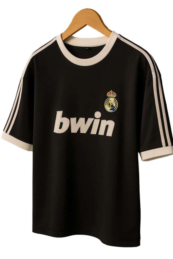 Authentic Real Madrid black football jersey with white accents and Bwin sponsor logo.