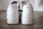 Nike Air Force 1 Low in white with light beige accents, classic and stylish sneaker for casual wear.