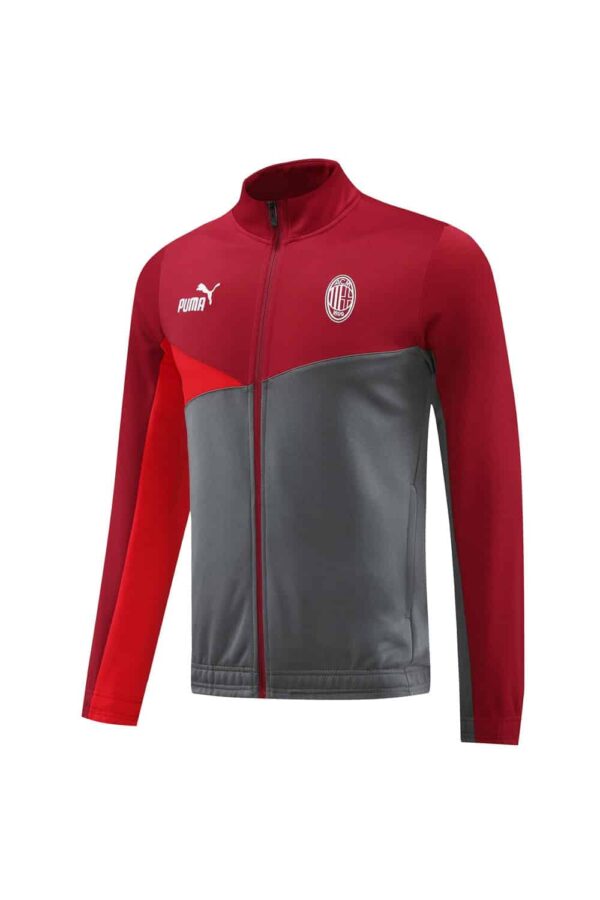 AC Milan pre-match jacket with red and gray design, Puma logo, and team crest.