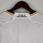 Authentic Real Madrid football jersey with "Hala Madrid!" text on the collar.