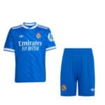 Authentic Real Madrid kids football jersey and shorts, blue color, official team merchandise.