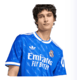 Authentic Real Madrid 2023 away football jersey in blue with club logo and sponsor.
