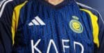 Authentic Al Nassr away football jersey 24/25 with Ronaldo 7, blue and yellow design.