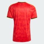Back view of a red sports jersey with a flame pattern and yellow trim on the sleeves.