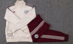 High-quality Adidas sports jacket and matching burgundy track pants, perfect for athletic training a.