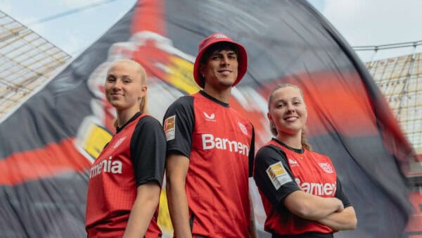 Bayer Leverkusen 2024/25 home football jersey with team logo and red-black design.