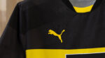 Dortmund away football jersey 2024/25 with Puma logo and team colors.