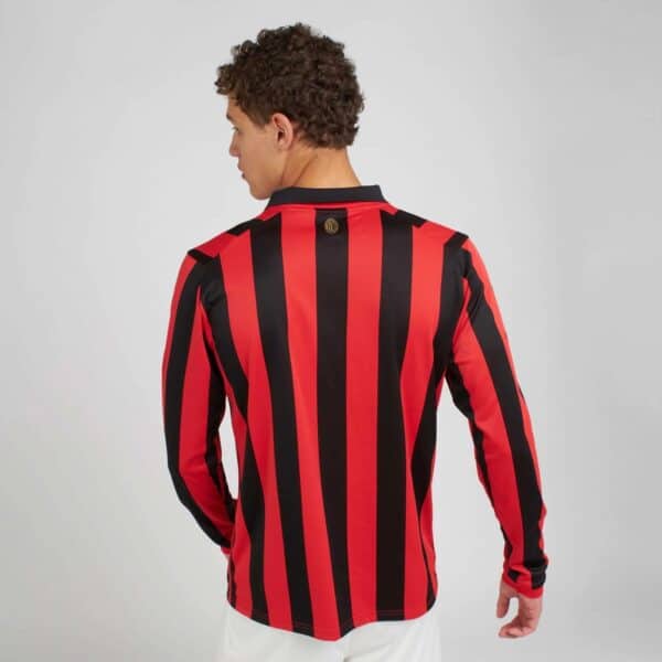 Milan football jersey with red and black vertical stripes, perfect for fans and players.