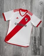River Plate 2023/24 home football jersey with red diagonal stripe and club crest.
