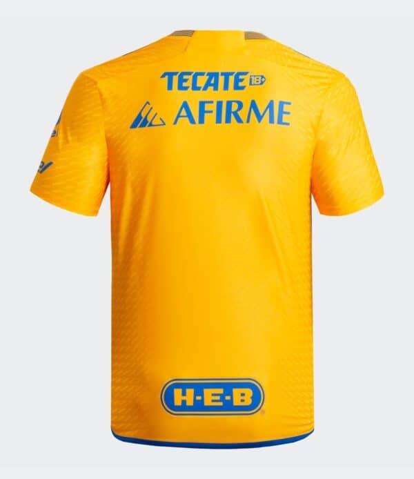 Tigres UANL 2023/24 home football jersey in vibrant yellow with sponsor logos, perfect for fans and.