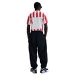 Atlético Madrid 2025/26 home football jersey with red and white stripes.
