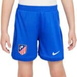 Kids Atletico Madrid football shorts with team logo and Nike branding.