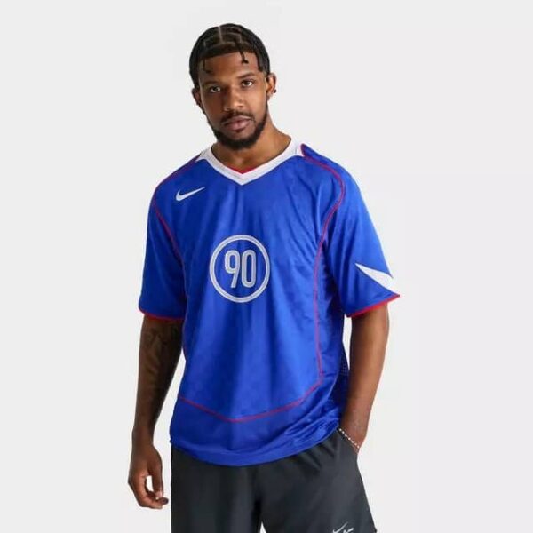 Nike Total 90 men's soccer jersey in blue with red accents and white logo.