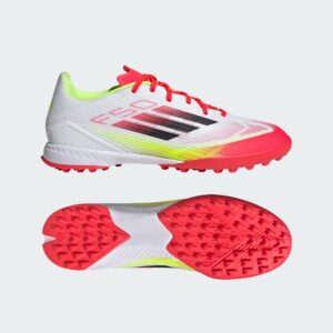 White running shoe with red laces and neon green interior, side view