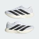 White Adidas running shoe in side profile with black three stripes and cream outsole, labeled LIGHTSTRIKE PRO.