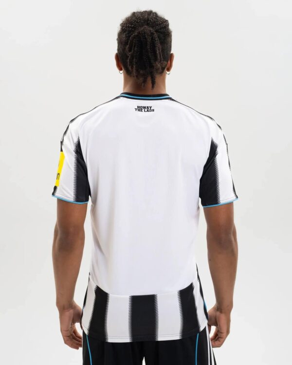 Newcastle United 2025/26 home football jersey, white with black stripes, for fans and players.