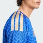 Italy national football team home jersey 2025/26 with blue and gold design.