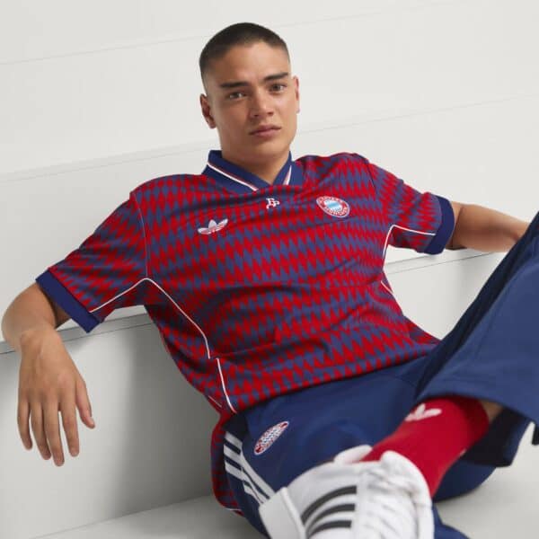 Authentic Bayern Munich football jersey 2025/26 season, red and blue design.