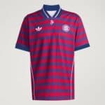 Red-and-blue diamond-patterned FC Bayern football jersey with Adidas logo on the chest and club crest on the left chest piece, short sleeves.