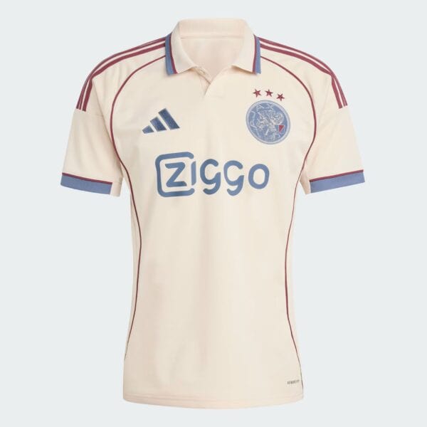 Cream Ajax football jersey with blue Adidas logo, Ziggo sponsor text, and three red stars above the crest on the left chest.