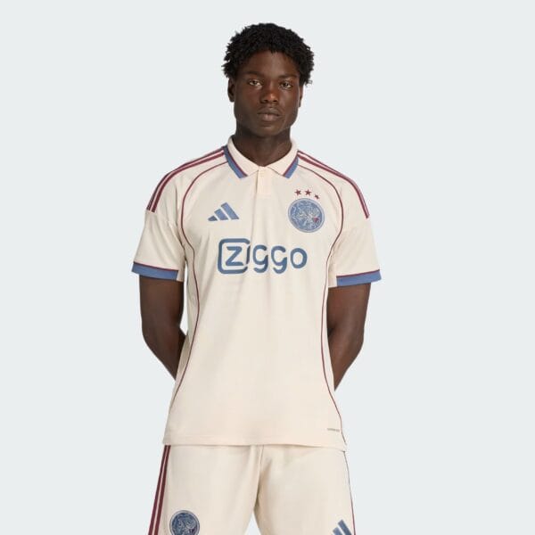 Ajax third football jersey 2025/26 with team logo and sponsor, perfect for fans and players.