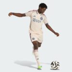 AJX Third Jersey 2025/26 with player in action, showcasing authentic football kit.