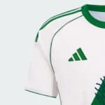 Authentic Al-Ahli Saudi football away jersey with green accents, perfect for fans and players.