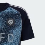 Nassr FC away football jersey 2025/26 with blue digital pattern and team logo.