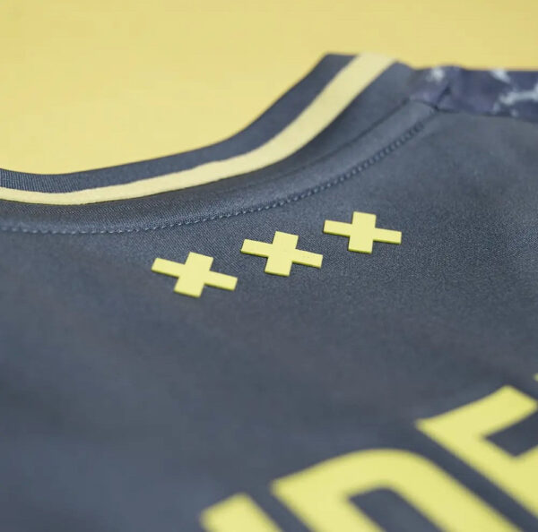 AJX Away jersey 2024/25 with yellow accents and premium fabric for football fans.