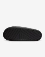 Black Nike Calm Slide for comfortable casual wear.