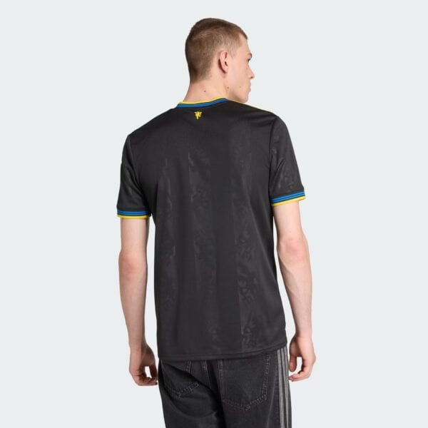 Authentic Manchester United third football jersey for 2025/26 season. Black design with blue and yel.