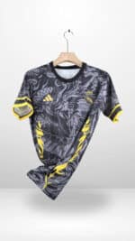 Authentic Real Madrid black and yellow football jersey with team logo and Adidas branding.