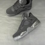 Air Jordan 4 Black sneakers for men, stylish and comfortable athletic footwear. Perfect for sports a.