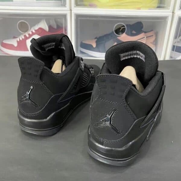 Air Jordan 4 Black sneakers with iconic Jumpman logo, premium leather, and stylish design. Perfect f.