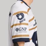 Authentic Pumas UNAM football jersey for 2024/25 season. White with gold and navy accents, featuring.