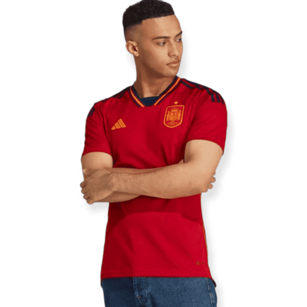 Spain 2022/23 World Cup home football jersey, red with yellow accents, official team kit.